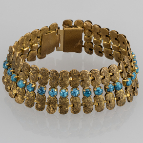 Wide bracelet in gold-plated silver with turquoise cabochon stones.