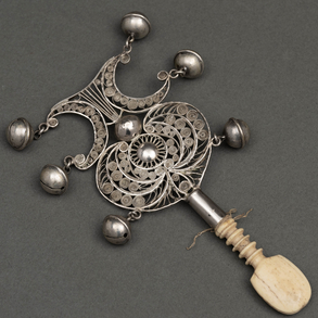 Silver filigree rattle with carved bone handle. Colonial work from the XIX century.