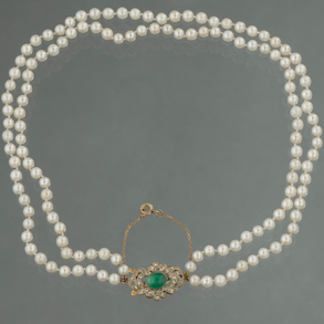 Two strand cultured pearl necklace with 18kt yellow gold and white gold cabochon emerald clasp.