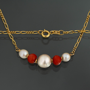 18kt yellow gold choker with cultured pearl and red coral beads.