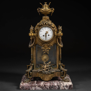 A late 19th century French Louis XVI gilt bronze table clock.