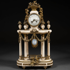 French table clock in the Louis XVI style in gilt bronze, white marble and wedgwod porcelain plate. French work from the 19th century