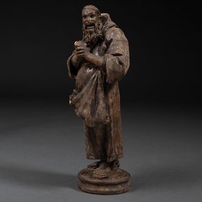 ‘Fruit seller ‘Set of two figures in carved and painted wood. 19th century