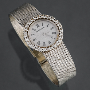 Longines - reloj de dama en oro blanco de 18kt con orla de brillantes.